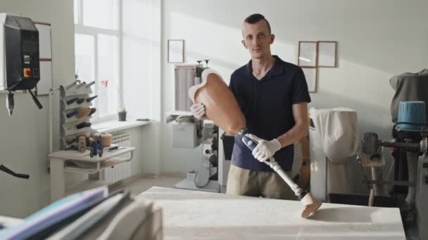 Portrait Young Adult Caucasian Man Holding Modern Prosthetic Leg Standing — Stock Video