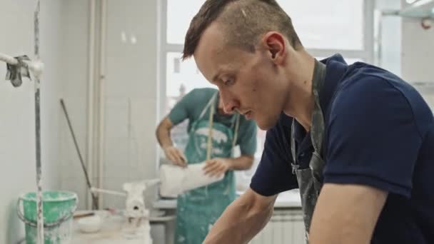 Selective Focus Young Adult Caucasian Man Wearing Apron Working Plaster — Stock Video