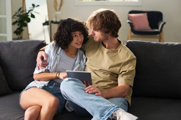 Young Man Jeans Shirt Embracing His Pretty Girlfriend Choosing Online — Stock Photo, Image