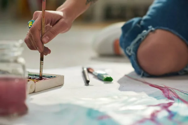 Close Hand Young Female Artist Paintbrush Sitting Floor Home Studio — Stock Photo, Image