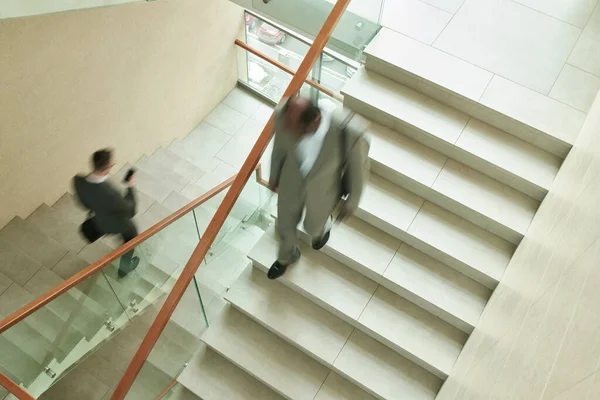 Blurred Motion Two Multicultural Male Employees Formalwear Walking Downstairs Staircase — Stock Photo, Image
