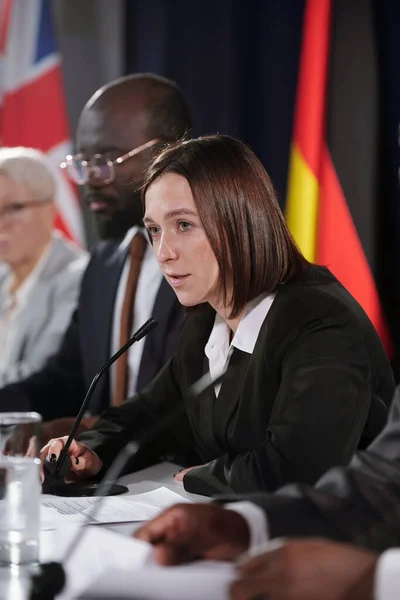 Young Female Politician Formalwear Speaking Microphone While Sitting Intercultural Foreign — Stock Photo, Image