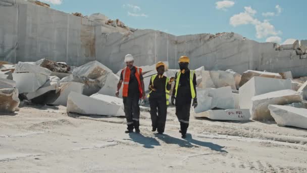Group Three Ethnically Diverse Mining Specialists Protective Workwear Walking Marble — Stock Video