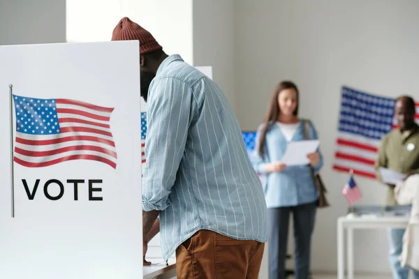 Side View Young African American Male Voter Filling Ballot While — Stock Photo, Image