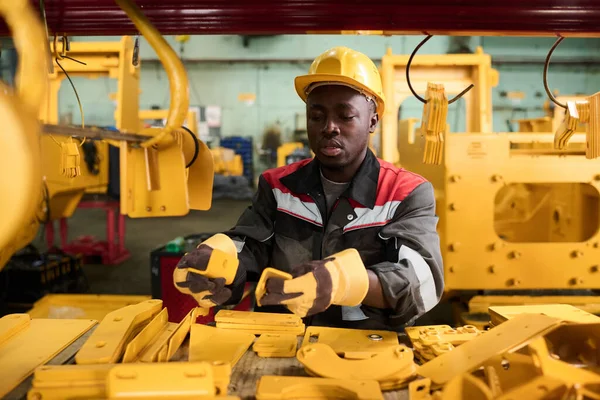 Young African American Male Engineer Factory Choosing New Spare Parts — Stock Photo, Image
