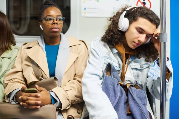Young Female Passenger Earphones Listening Music While Sitting Next Teenage — Stock Photo, Image