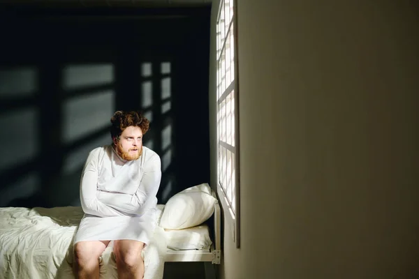 Young Insane Male Patient Mental Hospital Straitjacket Sitting Bed Looking — Stock Photo, Image