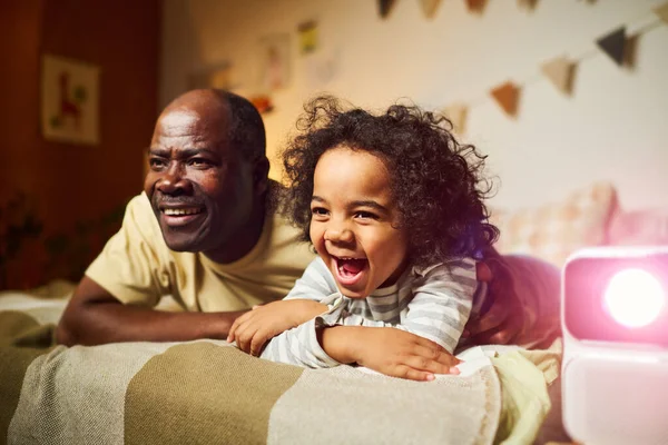 African American Family Two Watching Funny Film Projector Together While — Stock Photo, Image