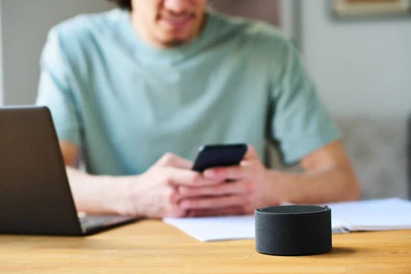 Close Young Man Connecting Smart Speaker His Smartphone While Sitting — Stock Photo, Image