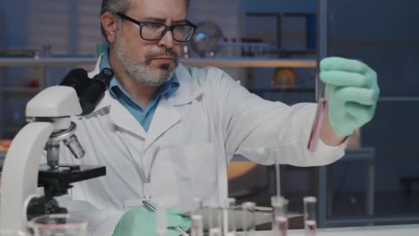 Tilt Mature Scientist Sitting Workplace Chemical Laboratory Studying Liquid Substances — Video Stock