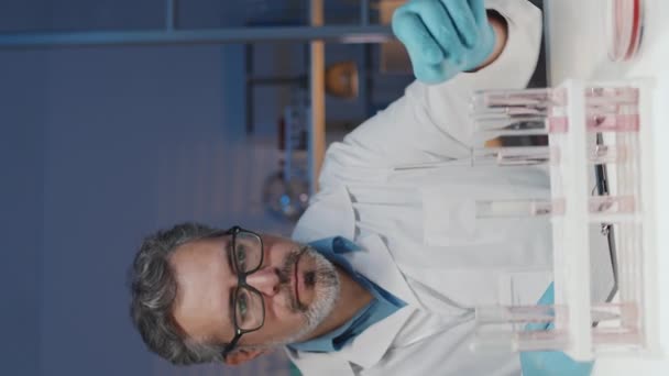 Vertical Shot Experienced Scientist Sitting Desk Laboratory Studying Characteristics Liquids — Wideo stockowe