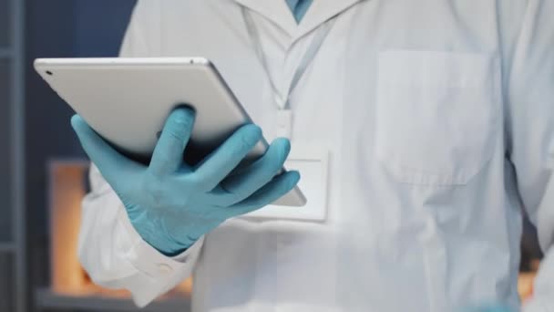 Close Male Researcher Gloves Lab Coat Entering Data Tablet While — Stock Video