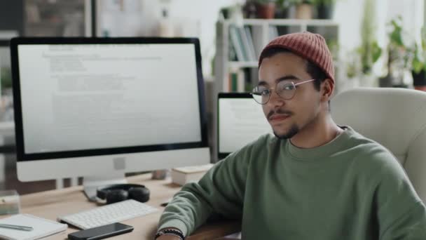 Portrait Young Programmer Eyeglasses Looking Camera While Working Computer Office — Stock Video