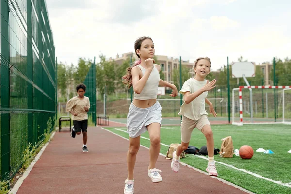 Active Schoolgirl White Sportswear Leading Running Competition While Moving Race — Stock Photo, Image