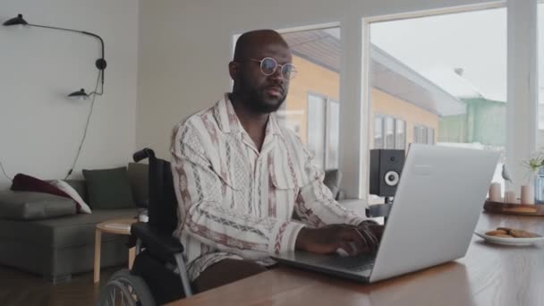 Medium Full Shot Black Man Typing Laptop Pausing Think Continuing — Stock Video