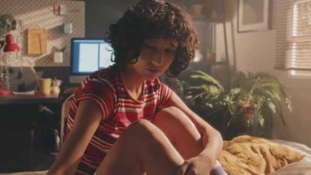 Medium Shot Sad Curly Young Girl Bright Shirt Sitting Her — Stock Video