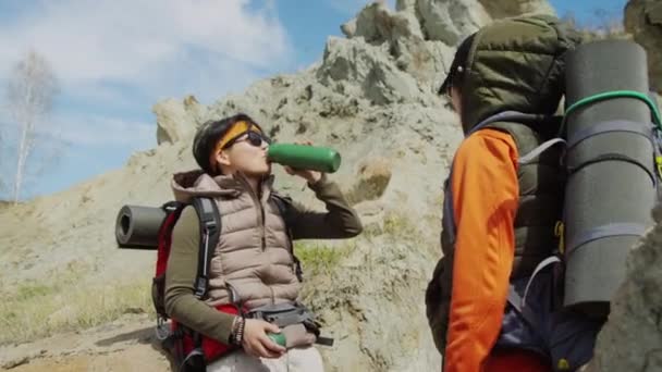 Medium Shot Two Asian Female Friends Rucksacks Tourists Drinking One — Stock Video