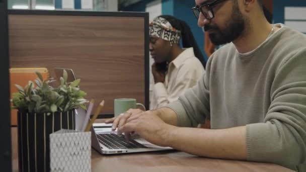 Medium Close Shot Middle Eastern Man Sitting Desk Cubicle Coworking — Stock Video