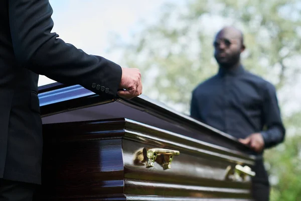 Two Intercultural Men Black Attire Closing Coffin Lid Farewell Ceremony — Stock Photo, Image