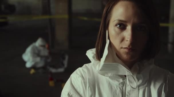 Close Portrait Shot Grim Caucasian Female Forensic Specialist White Overalls — Stock Video