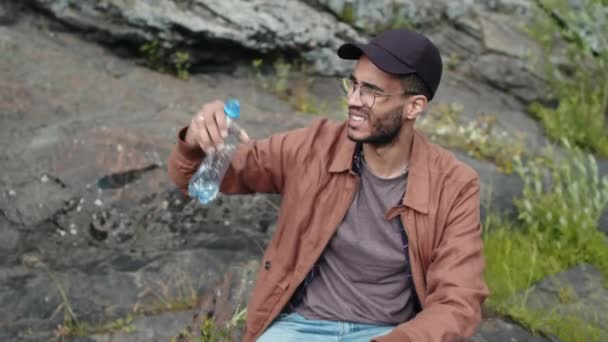 Medium Shot Young Male Biracial Tourist Having Last Sip Water — Stock Video