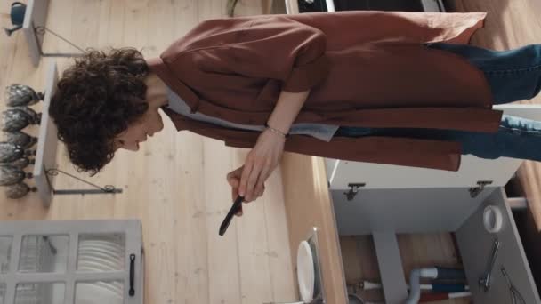 Vertical Medium Long Shot Caucasian Woman Curly Hair Standing Kitchen — Stock Video