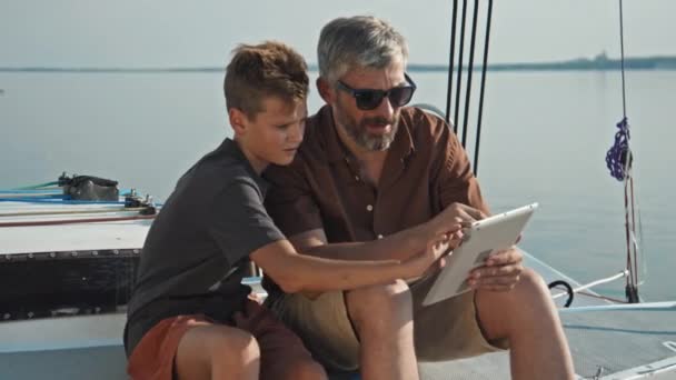 Mature Caucasian Man His Teen Son Sitting Board Yacht Using — Stock Video