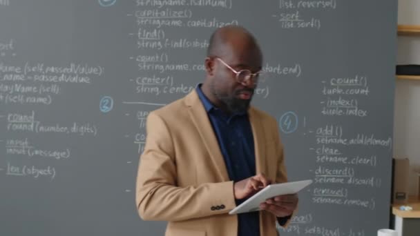 Tracking Shot Male African American Teacher Going Back Front Blackboard — Stock Video
