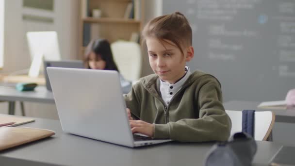 Slowmo Portrait Caucasian Elementary Age Boy Sitting Desk School Classroom — Stock Video