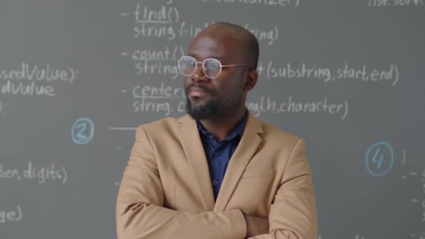 Medium Close Portrait Male African American Teacher Standing Front Blackboard — Stock Video