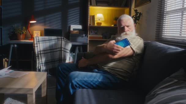 Full Shot Senior Man Grey Hair Beard Sitting Couch Living — Stock Video