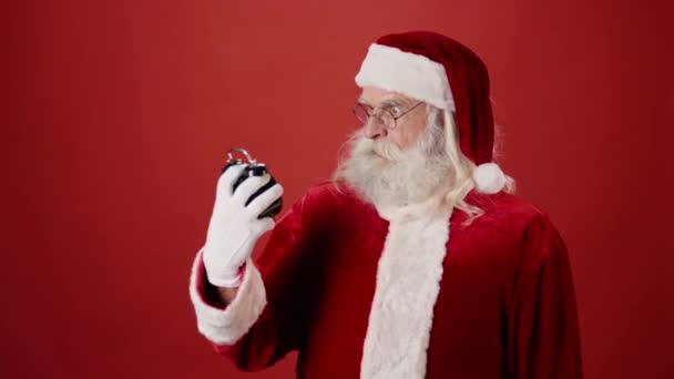 Medium Close Lockdown Shot Santa Claus Pointing Midnight Table Clock — Stock Video