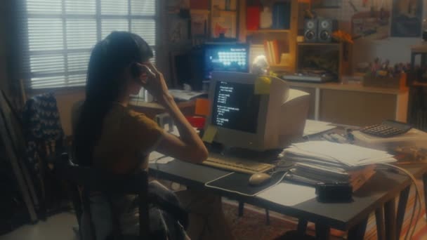 Portrait Young Female Software Developer Working Garage Office Putting Headphones — Stock Video