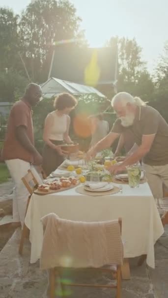 Vertical Shot Ethnically Diverse Family Setting Dining Table Backyard While — Stock Video