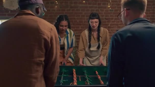 Ethnically Diverse Young Men Women Playing Table Soccer Loft Room — Stock Video