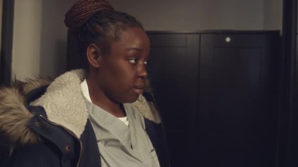 Medium Close Shot Young Black Woman Nurse Uniform Putting Parka — Stock Video