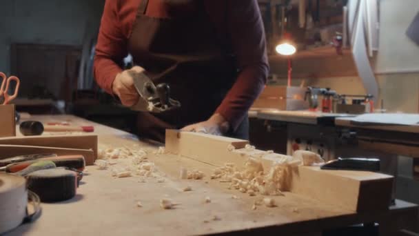 Tilt Shot Senior Caucasian Carpenter Removing Layers Wood Hand Plane — Stock Video