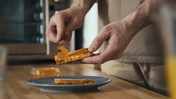 Side Stab Shot Male Hands Spreading Apricot Jam Toasted Slice — Stock Video