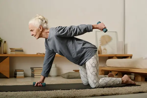 Side View Senior Active Woman Leggins Pullover Standing Knees Floor — Stock Photo, Image