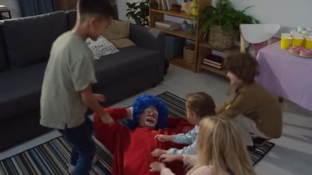 High Angle Footage Four Kids Tickling Male Clown Red Costume — Stock Video