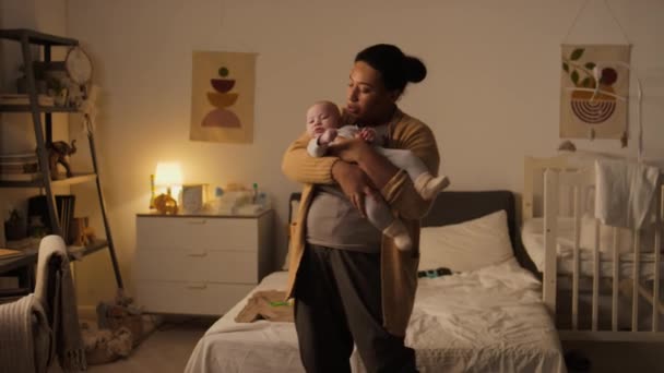 Medium Full Shot Hispanic Mother Casual Pyjamas Cardie Holding Fussy — Stock Video