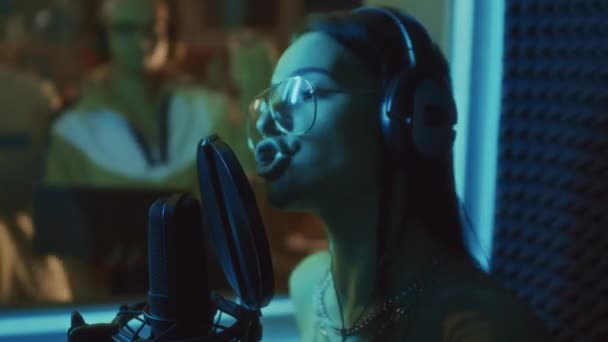 Side Closeup Pretty Caucasian Famous Singer Recording Song Neon Lit — Stock Video