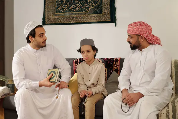 Modern Muslim Men Boy Sitting Couch Living Room Discussing Suwar Stock Image