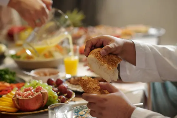 Selective Focus Closeup Hands Unrecognizable Muslim Man Tearing Piece Bread Stock Photo
