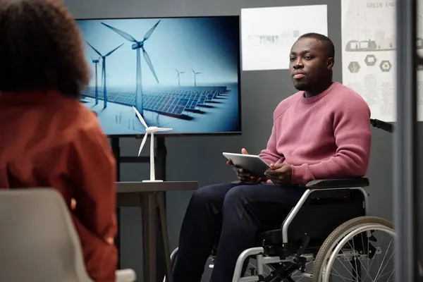 Young African American Man Disability Sitting Wheelchair Interactive Board Windmills Stock Picture