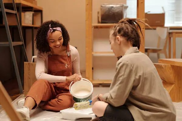 Happy Young African American Woman Brown Overalls Sitting Floor Next Stock Image