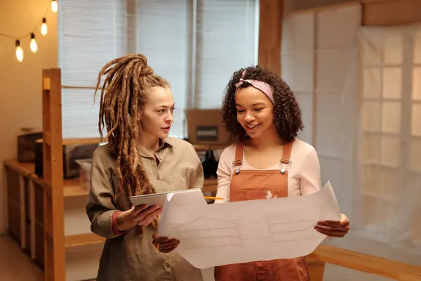 Happy Young African American Woman Overalls Holding Unrolled Blueprint Communication Stock Picture