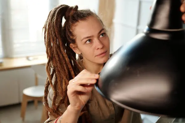 Young Female Owner Cafe Restaurant Dreadlocks Looking New Lamp While Stock Picture