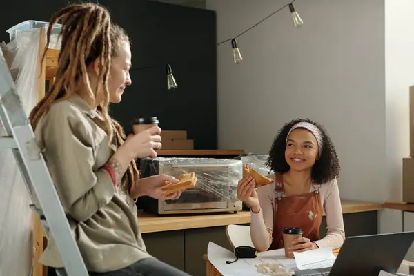 Happy Young African American Female Worker Brown Overalls Having Sandwich Stock Photo