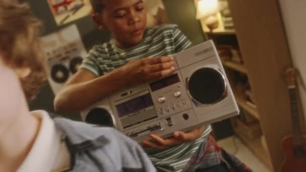 Pull Out Handheld Footage Black Boy Playing Music Jambox His — Stock Video